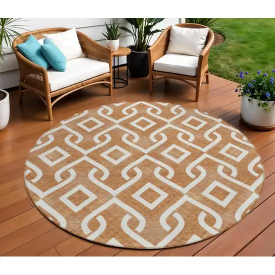 8' Orange And Ivory Round Geometric Washable Indoor Outdoor Area Rug Photo 1