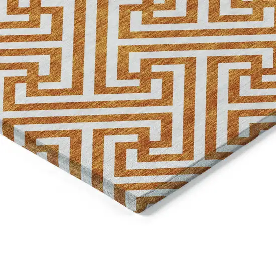 8' Orange And Ivory Round Geometric Washable Indoor Outdoor Area Rug Photo 3