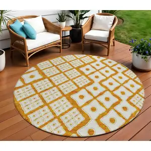 Photo of 8' Orange And Ivory Round Geometric Washable Indoor Outdoor Area Rug