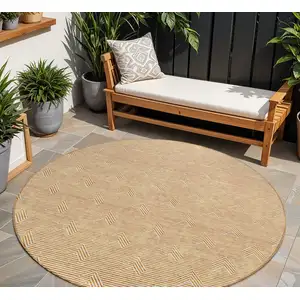 Photo of 8' Orange And Ivory Round Geometric Washable Indoor Outdoor Area Rug
