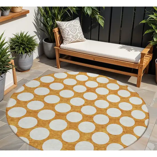 8' Orange And Ivory Round Polka Dot Washable Indoor Outdoor Area Rug Photo 1
