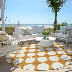 Photo of 8' Orange And Ivory Round Polka Dot Washable Indoor Outdoor Area Rug