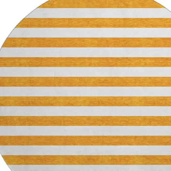 8' Orange And Ivory Striped Washable Round Rug With UV Protection Photo 3