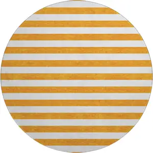 Photo of 8' Orange And Ivory Striped Washable Round Rug With UV Protection