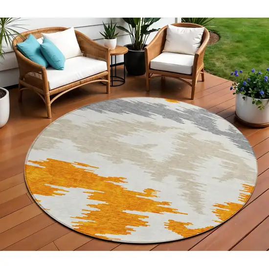 8' Orange Beige And Ivory Round Abstract Washable Indoor Outdoor Area Rug Photo 1