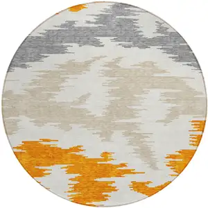 Photo of 8' Orange Beige And Ivory Round Abstract Washable Indoor Outdoor Area Rug