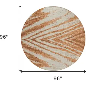 Photo of 8' Orange Brown And Beige Round Abstract Washable Indoor Outdoor Area Rug