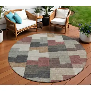 Photo of 8' Orange Copper And Charcoal Round Geometric Washable Indoor Outdoor Area Rug