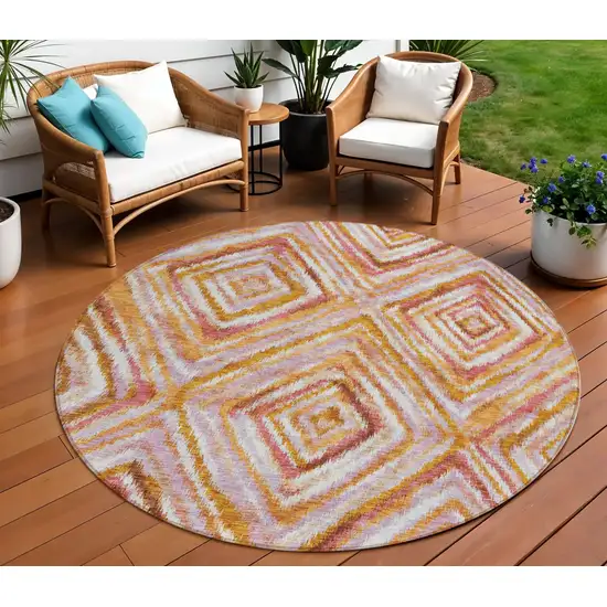 8' Orange Copper And Gold Round Geometric Washable Indoor Outdoor Area Rug Photo 1