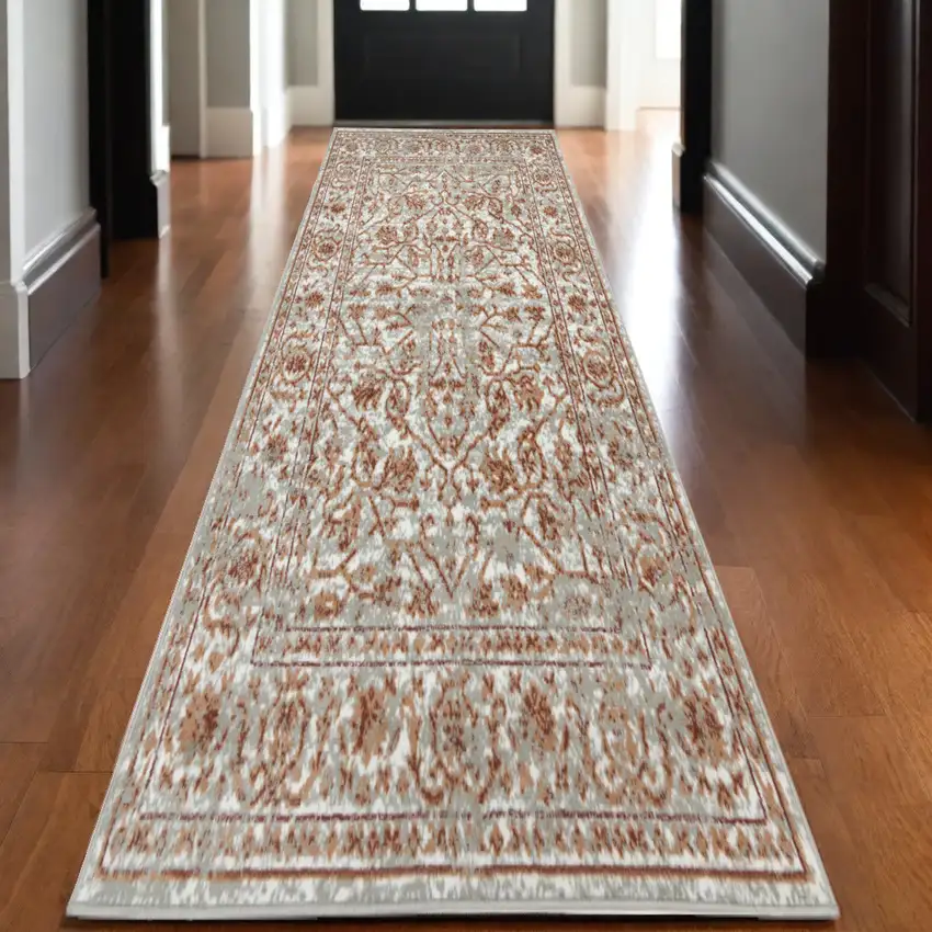 10' Rust and Gray Floral Power Loom Runner Rug Photo 1