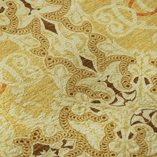 8' Orange Gold And Ivory Medallion Washable Round Rug With UV Protection Photo 9