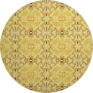 Photo of 8' Orange Gold And Ivory Medallion Washable Round Rug With UV Protection