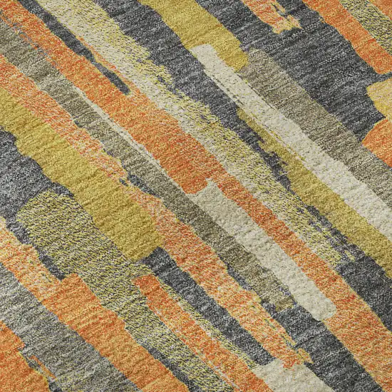 8' Orange Gold And Ivory Striped Washable Area Rug With UV Protection Photo 1