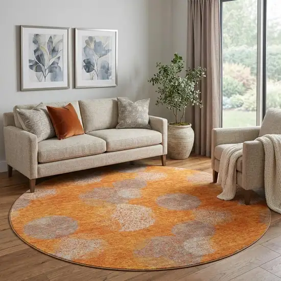 8' Orange Gray And Silver Abstract Washable Round Rug With UV Protection Photo 1