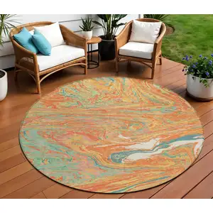 Photo of 8' Orange Green And Beige Round Abstract Washable Indoor Outdoor Area Rug