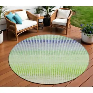 Photo of 8' Orange Green And Blue Round Striped Washable Indoor Outdoor Area Rug