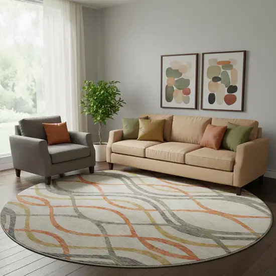 8' Orange Ivory And Gold Abstract Washable Round Rug With UV Protection Photo 1