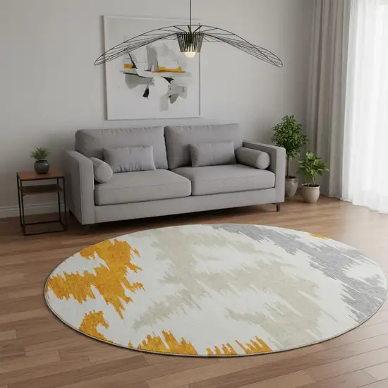 8' Orange Ivory And Gray Abstract Washable Round Rug With UV Protection Photo 2