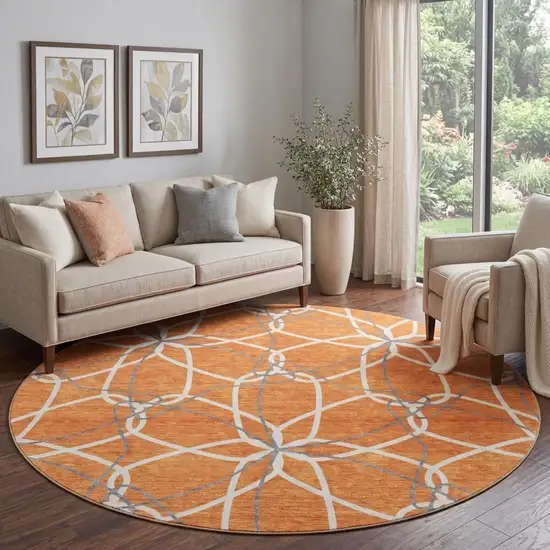 8' Orange Ivory And Gray Geometric Washable Round Rug With UV Protection Photo 1