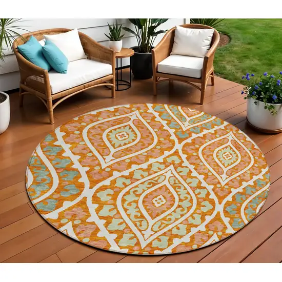8' Orange Peach And Ivory Round Floral Washable Indoor Outdoor Area Rug Photo 1