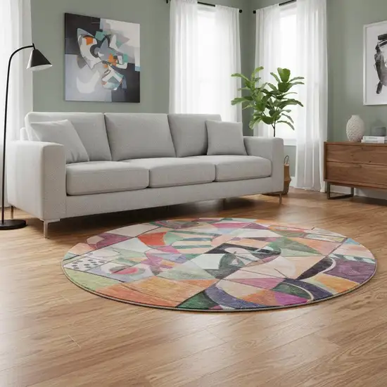 8' Orange Pink And Ivory Abstract Washable Round Rug With UV Protection Photo 2