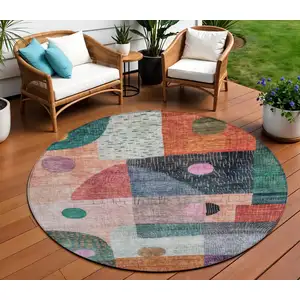Photo of 8' Orange Purple And Green Round Geometric Washable Indoor Outdoor Area Rug