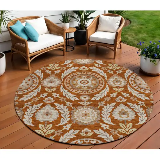 8' Orange Taupe And Gold Round Floral Washable Indoor Outdoor Area Rug Photo 1