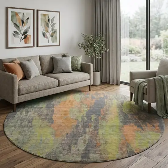 8' Orange Teal And Gold Abstract Washable Round Rug With UV Protection Photo 1