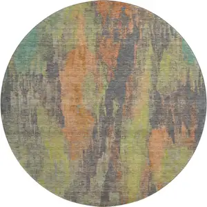 Photo of 8' Orange Teal And Gold Abstract Washable Round Rug With UV Protection