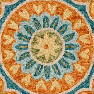 Photo of 6' Orange and Blue Round Wool Floral Hand Tufted Area Rug