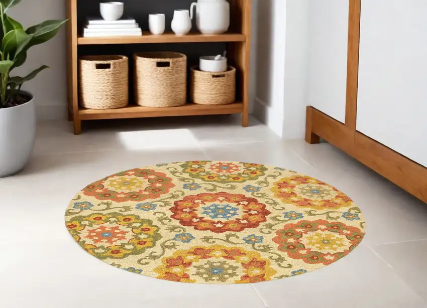 6' Orange and Ivory Round Wool Floral Hand Tufted Area Rug Photo 1