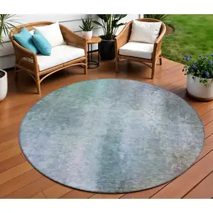 Photo of 8' Pale Aqua And Lavender Round Abstract Washable Indoor Outdoor Area Rug