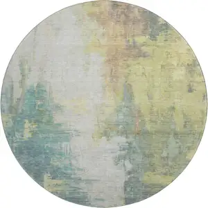Photo of 8' Pale Aqua Ivory And Teal Abstract Washable Round Rug With UV Protection