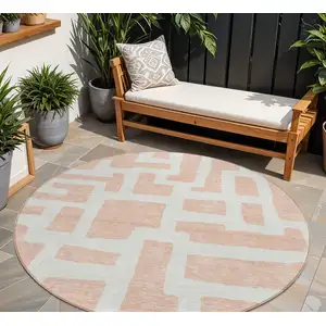 Photo of 8' Peach And Gray Round Abstract Washable Indoor Outdoor Area Rug