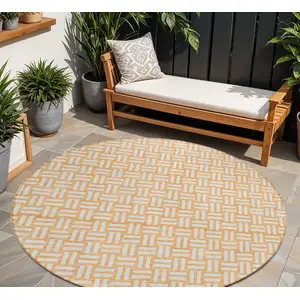 Photo of 8' Peach And Gray Round Geometric Washable Indoor Outdoor Area Rug