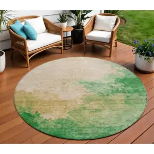 Photo of 8' Peach And Green Round Abstract Washable Indoor Outdoor Area Rug