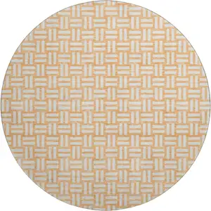 Photo of 8' Peach And Ivory Abstract Geometric Washable Round Rug With UV Protection