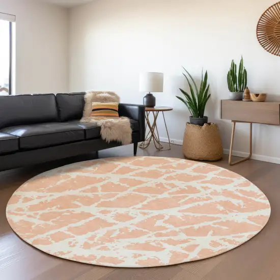 8' Peach And Ivory Abstract Washable Round Rug With UV Protection Photo 5