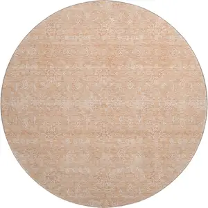 Photo of 8' Peach And Ivory Floral Washable Round Rug With UV Protection