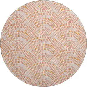 Photo of 8' Peach And Ivory Geometric Washable Round Rug With UV Protection