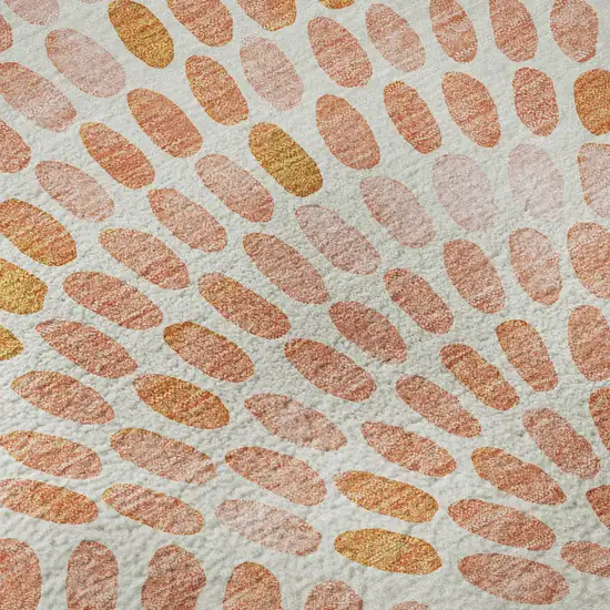 8' Peach And Ivory Geometric Washable Round Rug With UV Protection Photo 9
