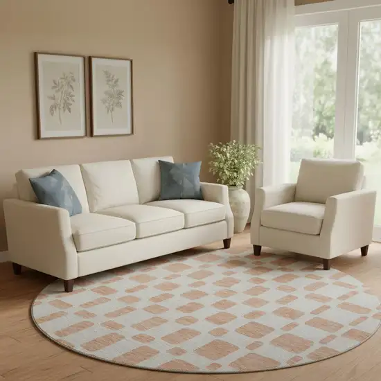 8' Peach And Ivory Geometric Washable Round Rug With UV Protection Photo 1