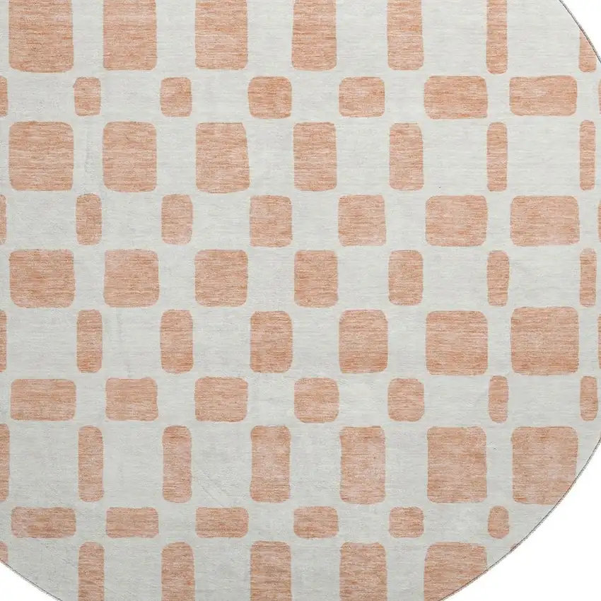 8' Peach And Ivory Geometric Washable Round Rug With UV Protection Photo 3