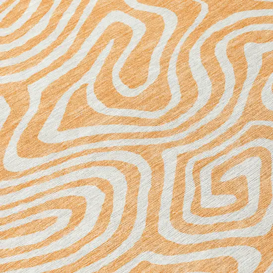 8' Peach And Ivory Round Abstract Washable Indoor Outdoor Area Rug Photo 4