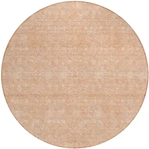 Photo of 8' Peach And Ivory Round Floral Washable Indoor Outdoor Area Rug
