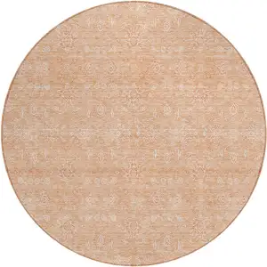 Photo of 8' Peach And Ivory Round Floral Washable Indoor Outdoor Area Rug