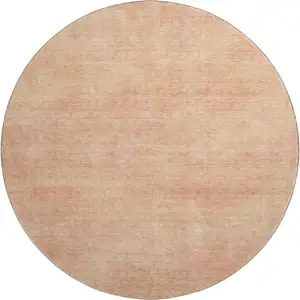 Photo of 8' Peach And Salmon Abstract Washable Round Rug With UV Protection