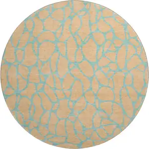 Photo of 8' Peach And Teal Geometric Washable Round Rug With UV Protection