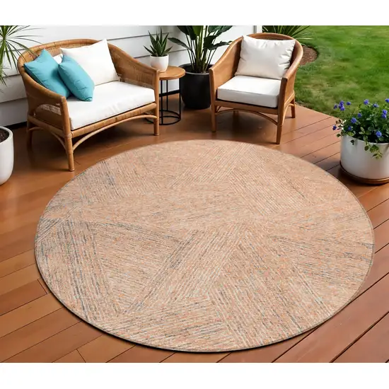 8' Peach Blue And Ivory Round Abstract Washable Indoor Outdoor Area Rug Photo 1