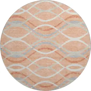 Photo of 8' Peach Gray And Ivory Abstract Washable Round Rug With UV Protection
